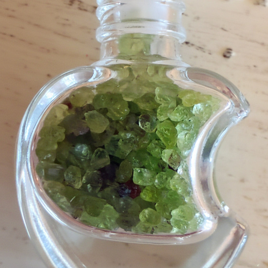 Clear, moon shaped wish bottle filled with Aventurine Chips