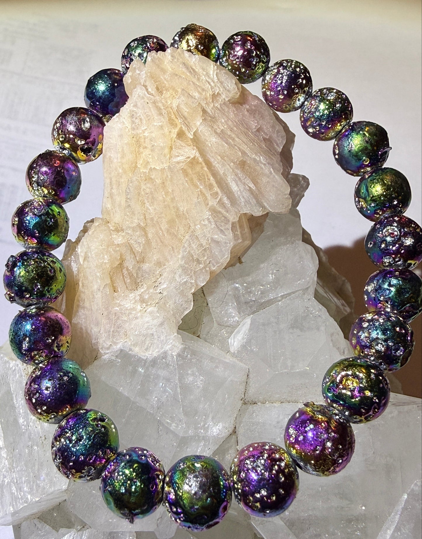 close up of a rainbow aura lava stone bracelet vibrant rainbow colors 9mm bead bracelet