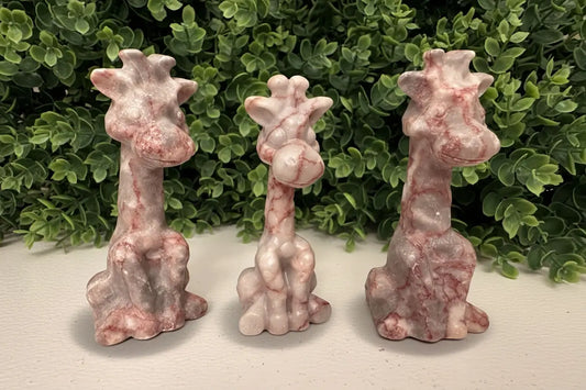3 giraffes carved from red vein jasper crystal Bright pink iron oxide pigments 