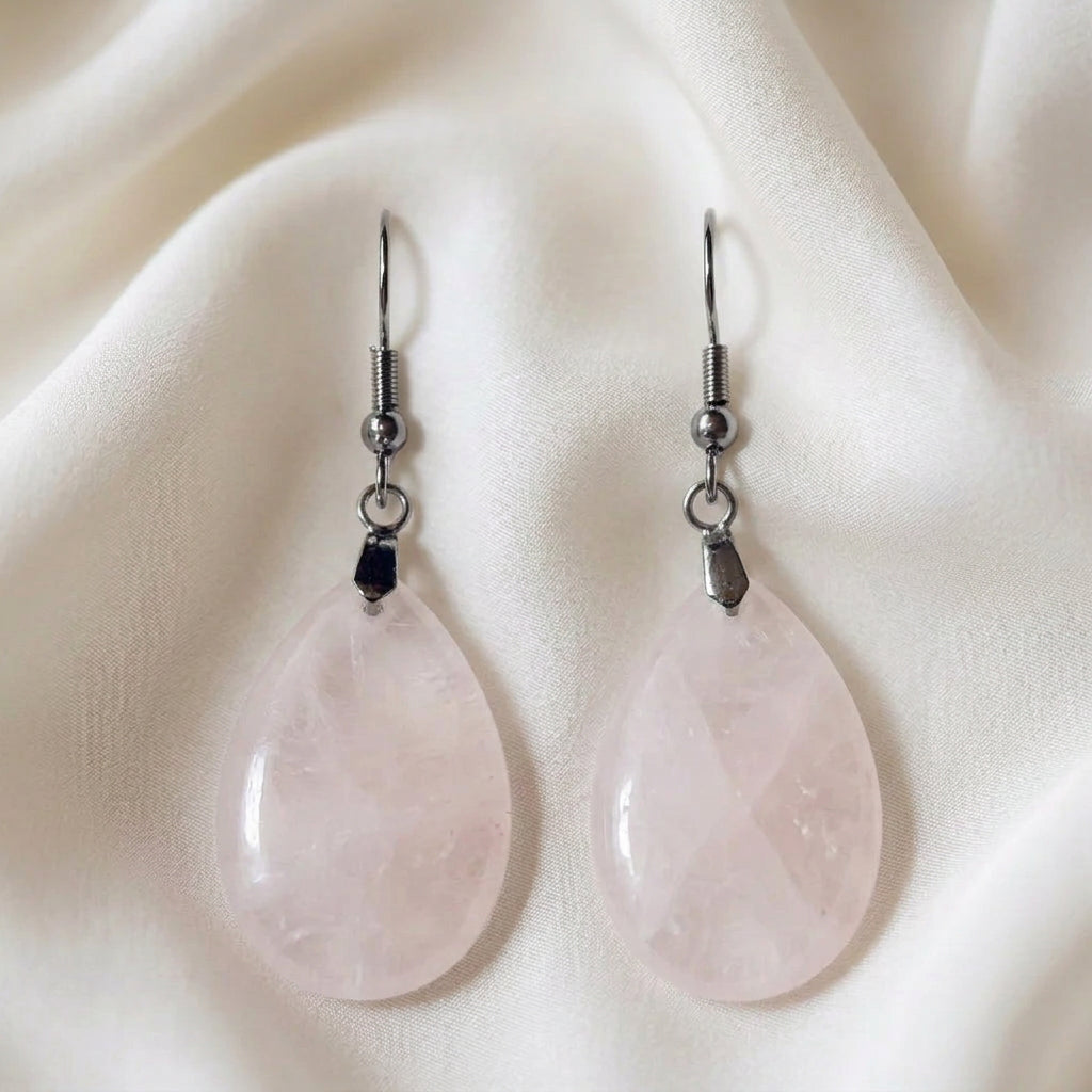 close up photo rose quartz carved tear drop earrings