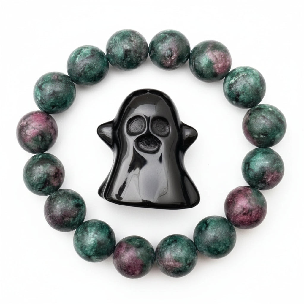Ruby in Zoisite elastic fit bead bracelet and a carved black obsidian ghost figurine