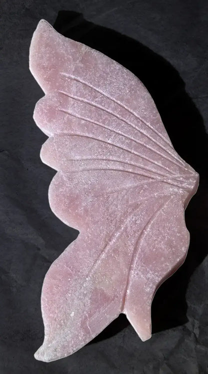 Close-up pink opal butterfly showing beautiful carvings
