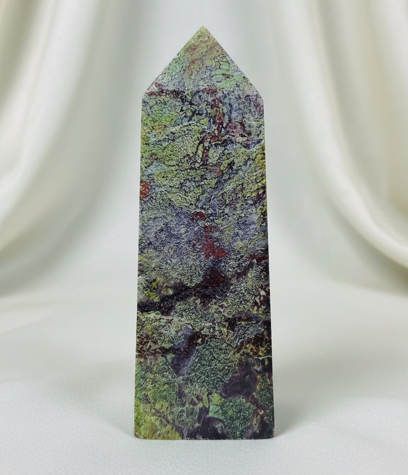 Side View of a dragons blood tower  four side tower with greens and red