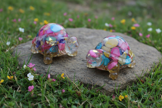 picture close up of two dyed agate resin mini turtles colorful carnival colors 