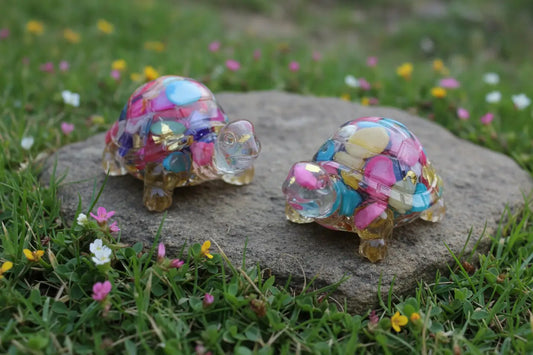 picture close up of two dyed agate resin mini turtles colorful carnival colors 