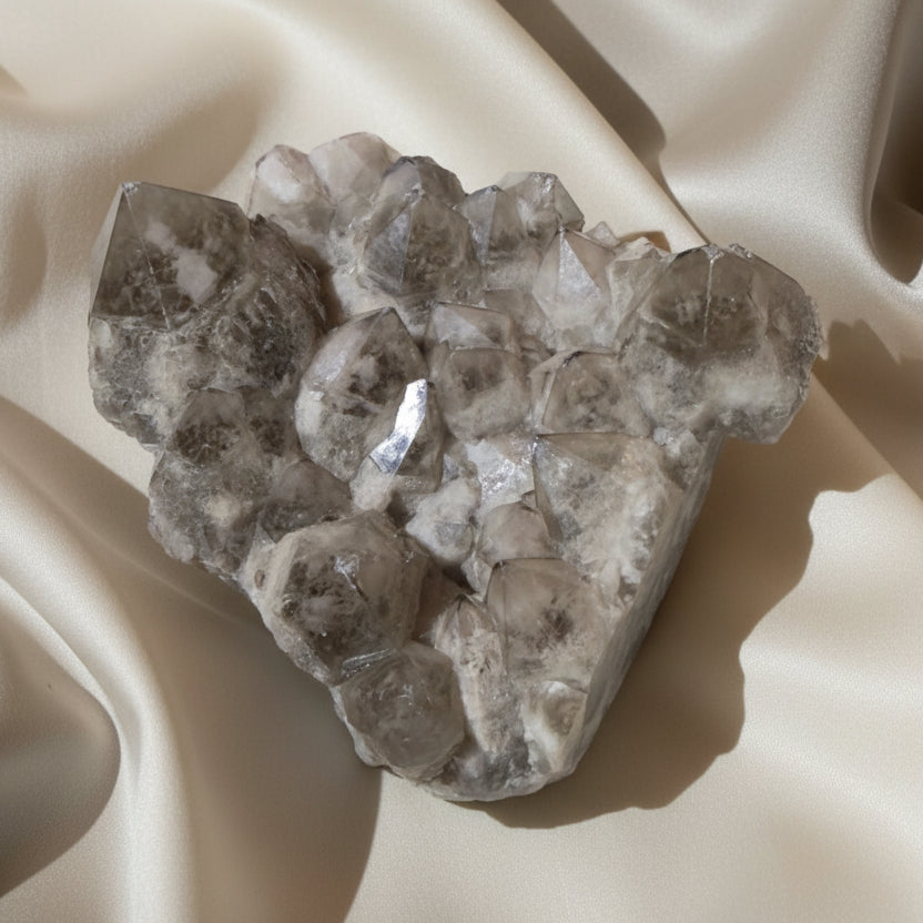 A natural quartz crystal cluster specimen with multiple hexagonal crystal points 