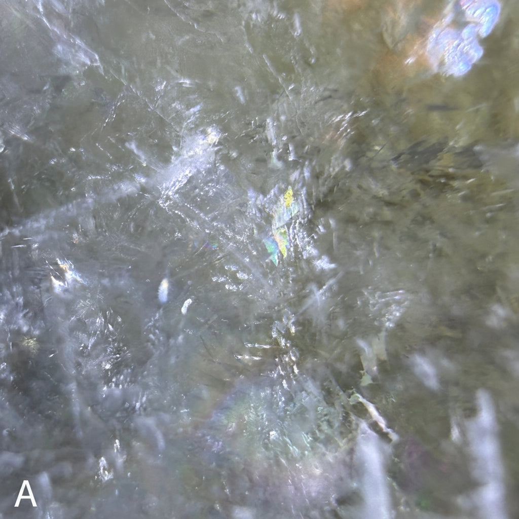 Super close up of white calcite specimen A showing rainbows 