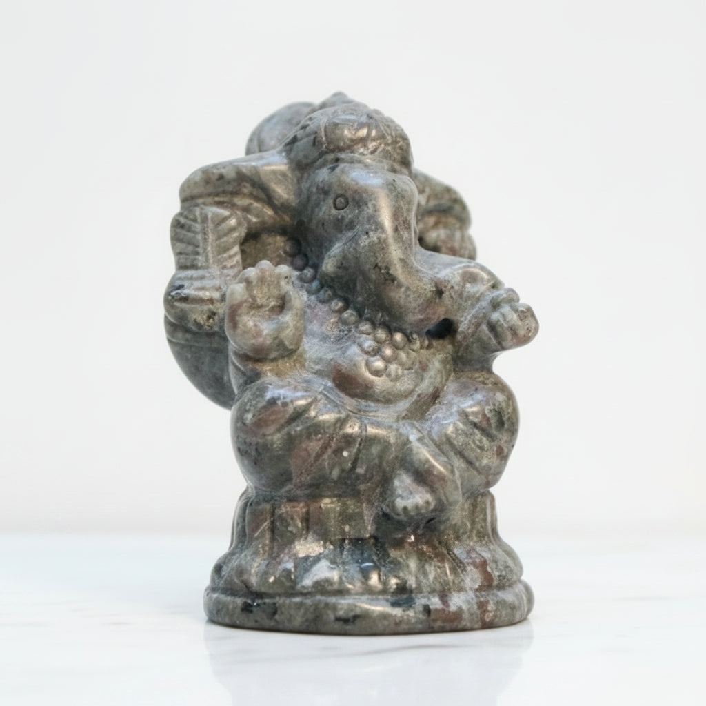 A small carved statue of Ganesha carved from UV reactive Yooperlite Stone