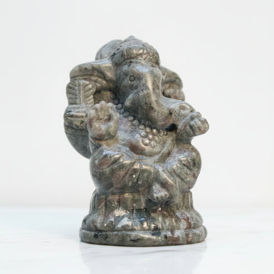 A small carved statue of Ganesha carved from UV reactive Yooperlite Stone