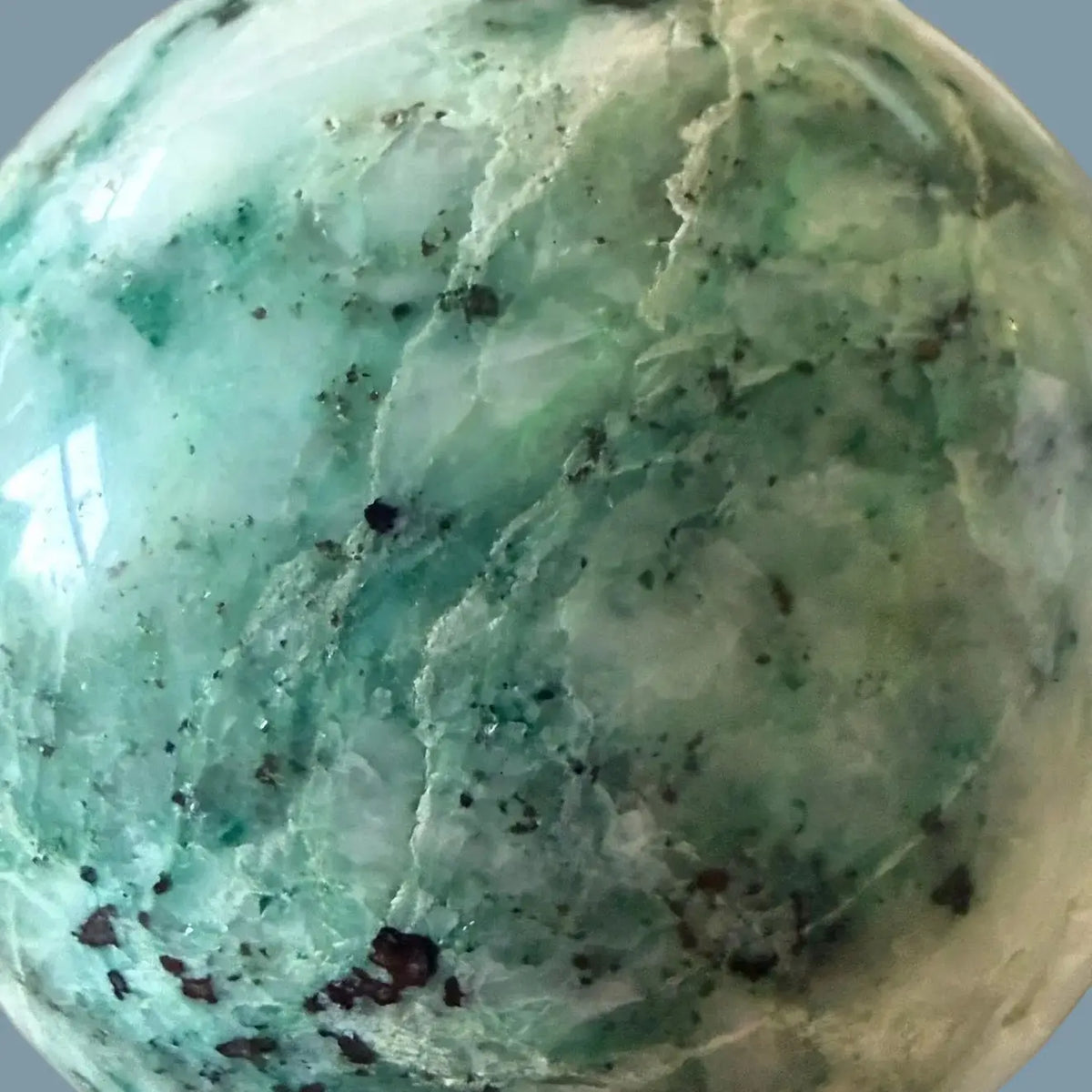 close-up chrysocolla in quartz spahere beautiful blues, teals, dark blues white quartz