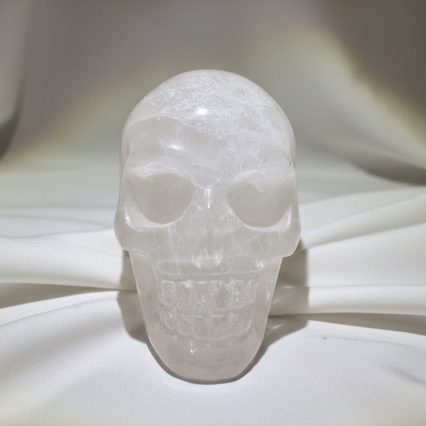 close up front view of clear quartz hand carved skull