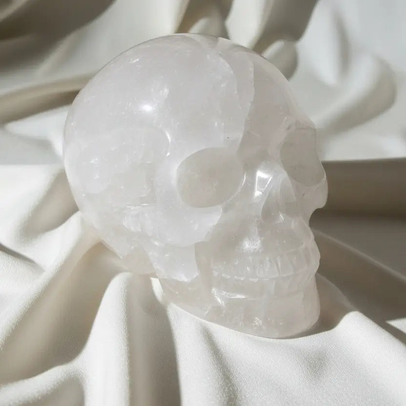 side view clear quartz skull with mineral inclusions