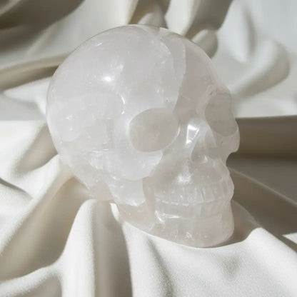 side view clear quartz skull with mineral inclusions