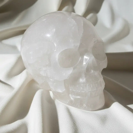 side view clear quartz skull with mineral inclusions