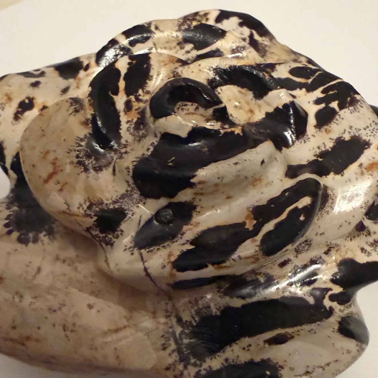 side view close up of dendritic jasper carved  flower 
