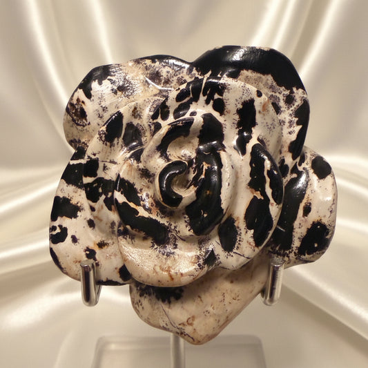 close up of dendritic jasper carved flower warm brown, soft tones sand colors
