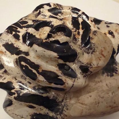 close up of dendritic jasper carved flower browns, dark chocolate colors 