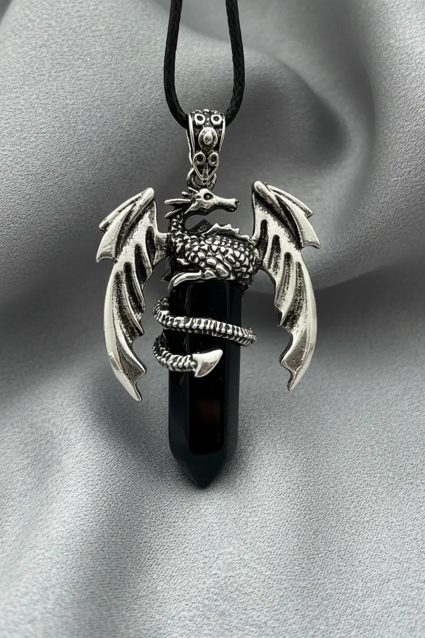 Dragon pendant necklace with black gemstone, silver dragon with spread wings.
