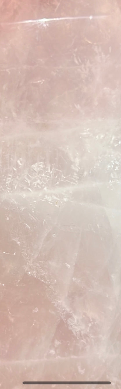 Close-up of a pale pink rose quartz crystal.