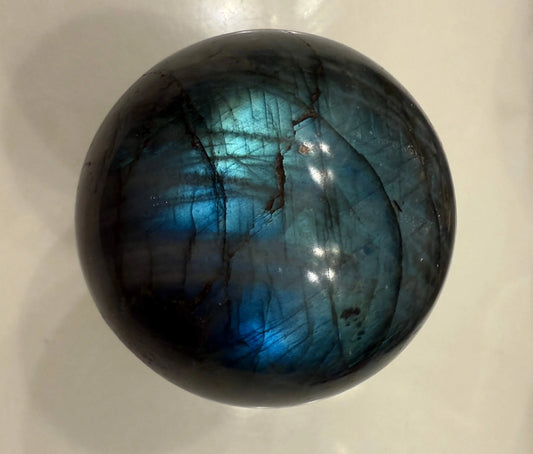 Madagascar Labradorite crystal sphere front view  amazing flash