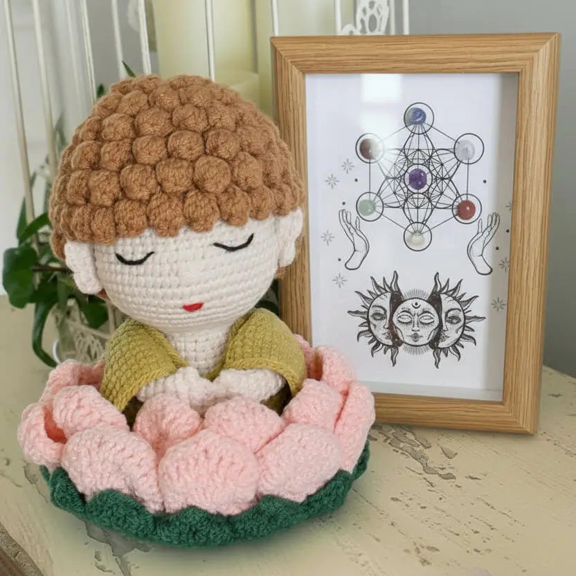 hand crafted crochet buddha in a lotus flower, framed chakra stones in a shadow box 