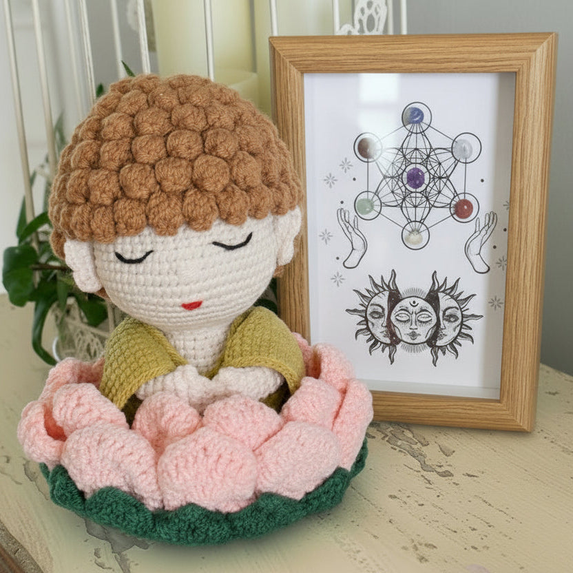 hand crafted crochet buddha in a lotus flower, framed chakra stones in a shadow box 