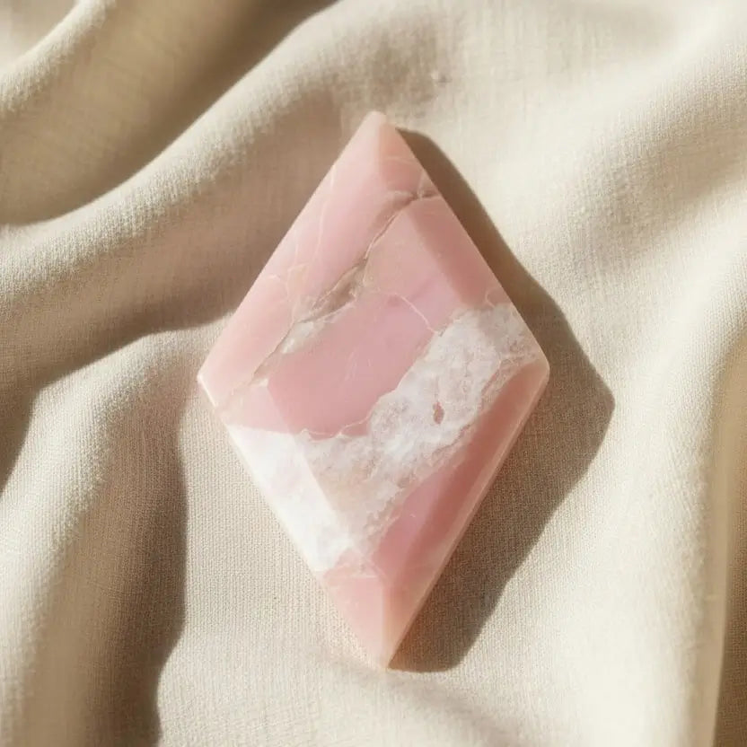 close up of pink opal carving diamond shape
