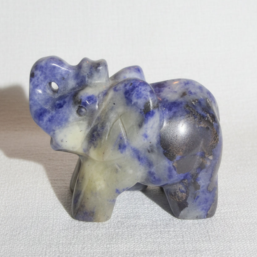 lapis lazuli carving of an elephant with his trunk up for good luck 