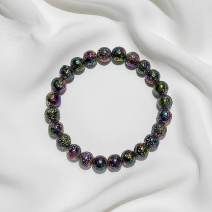 looking down at a rainbow aura bead bracelet 9mm beads beautiful vibrant colors 