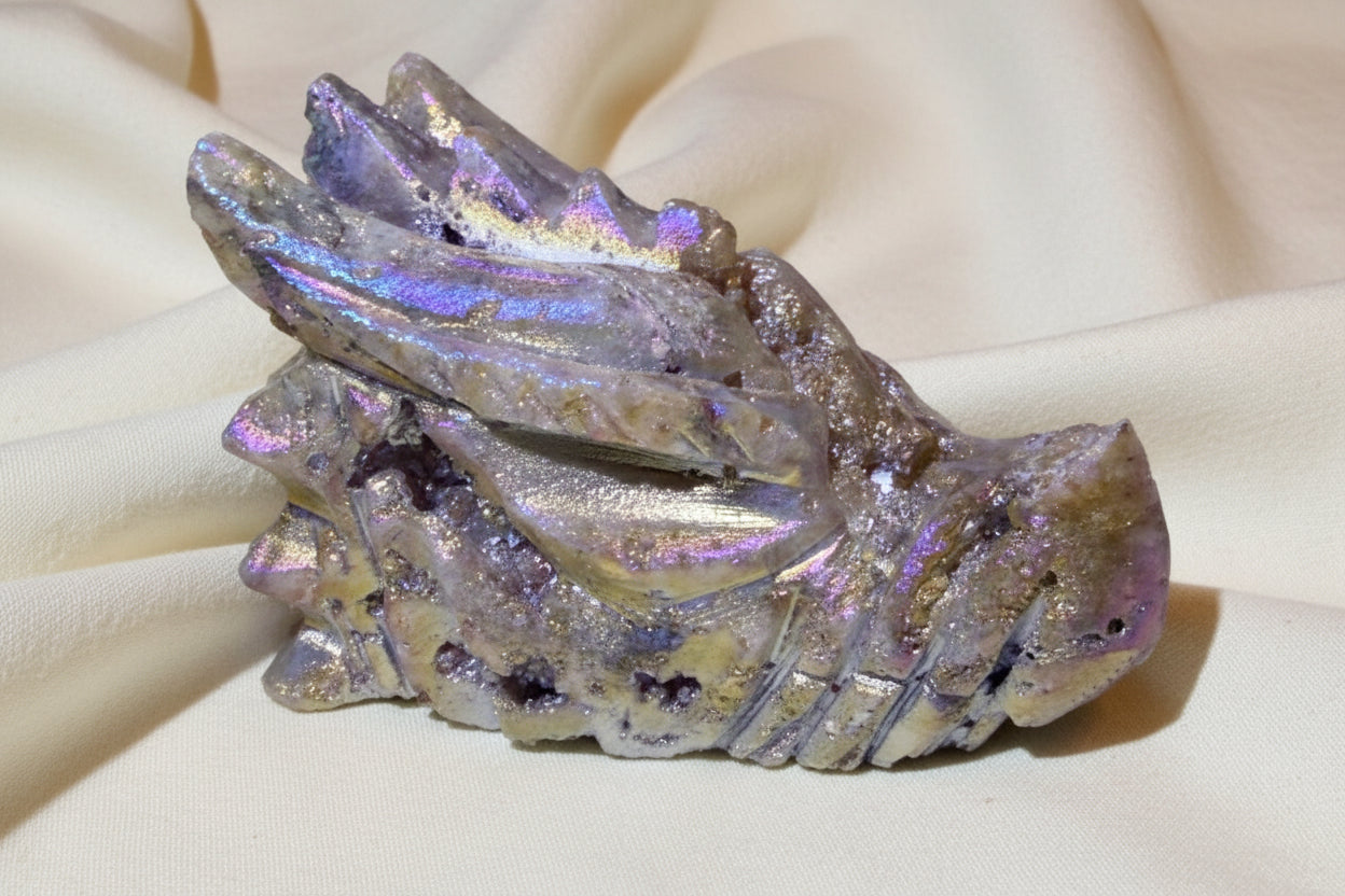 beautiful photo close up of rainbow aura carved dragon skull beautiful colors and bright druzy pockets