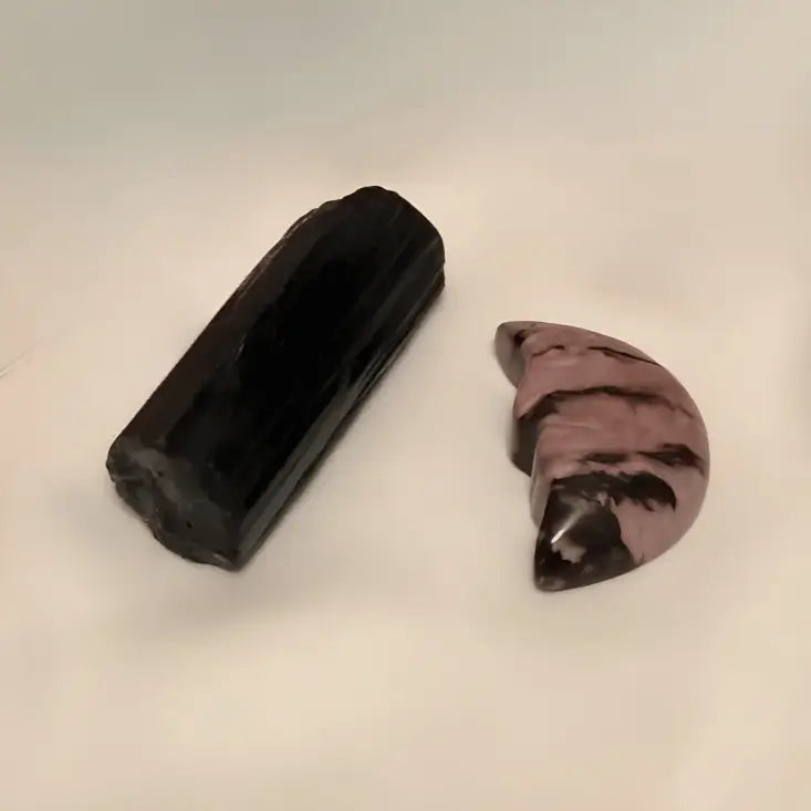 Close up rhodonite crescent moon band black tourmaline specimen