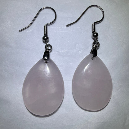 close up of a pair of rose quartz tear drop earrings 