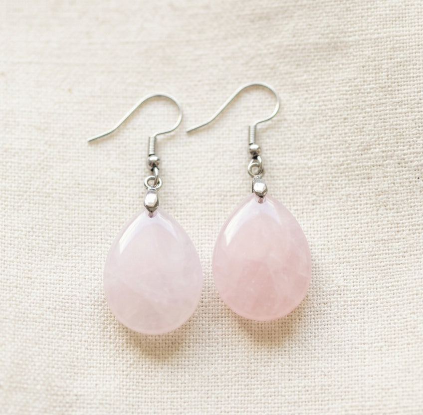 pink rose quartz tear drop earrings close up photo
