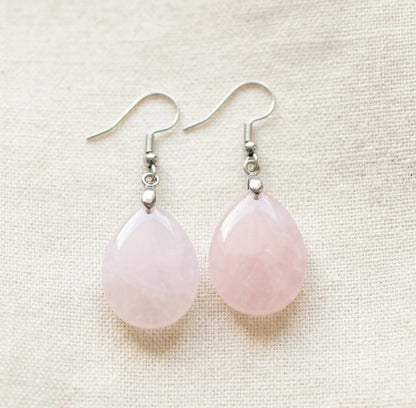 pink rose quartz tear drop earrings close up photo
