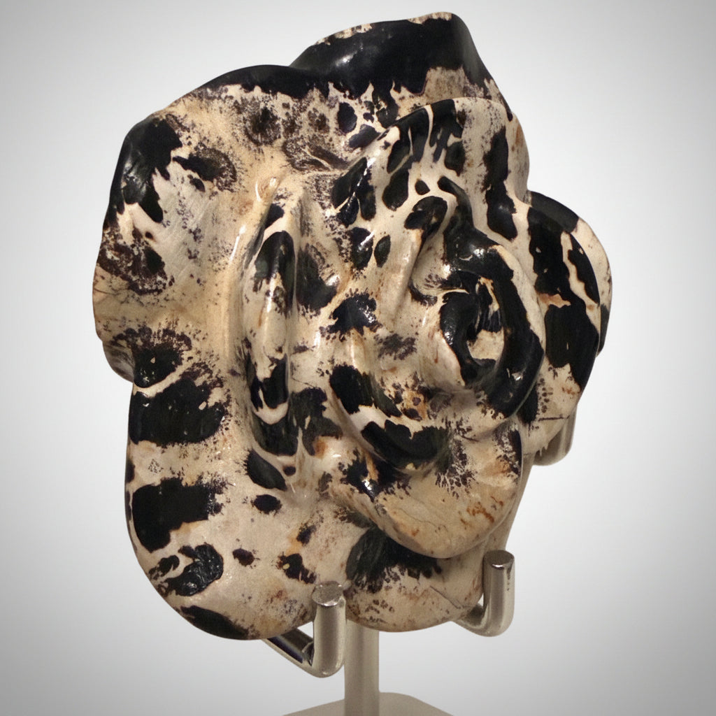 Side view close up dendritic agate carved flower in a stand 