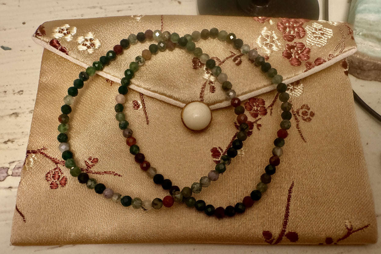 Brown and reddish silk bag with two 3mm Elbaite bracelets 