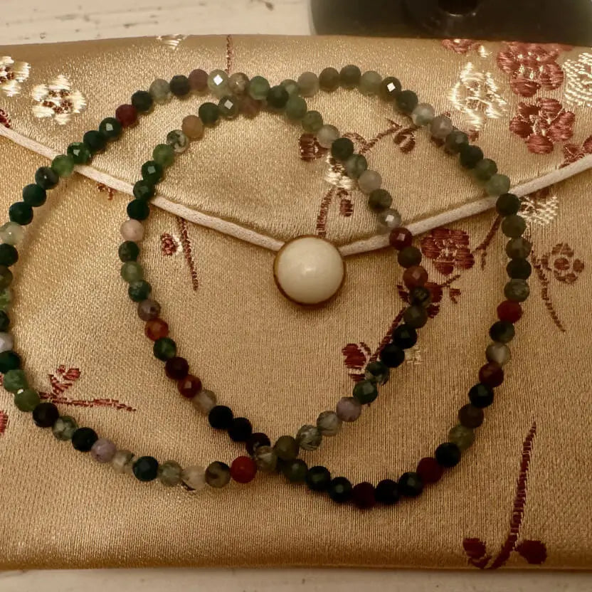 Brown and reddish silk bag with two 3mm Elbaite bracelets 