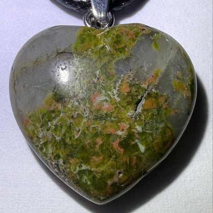 photo unakite hand carved heart pendant with natural fractures, on a waxed leather cord