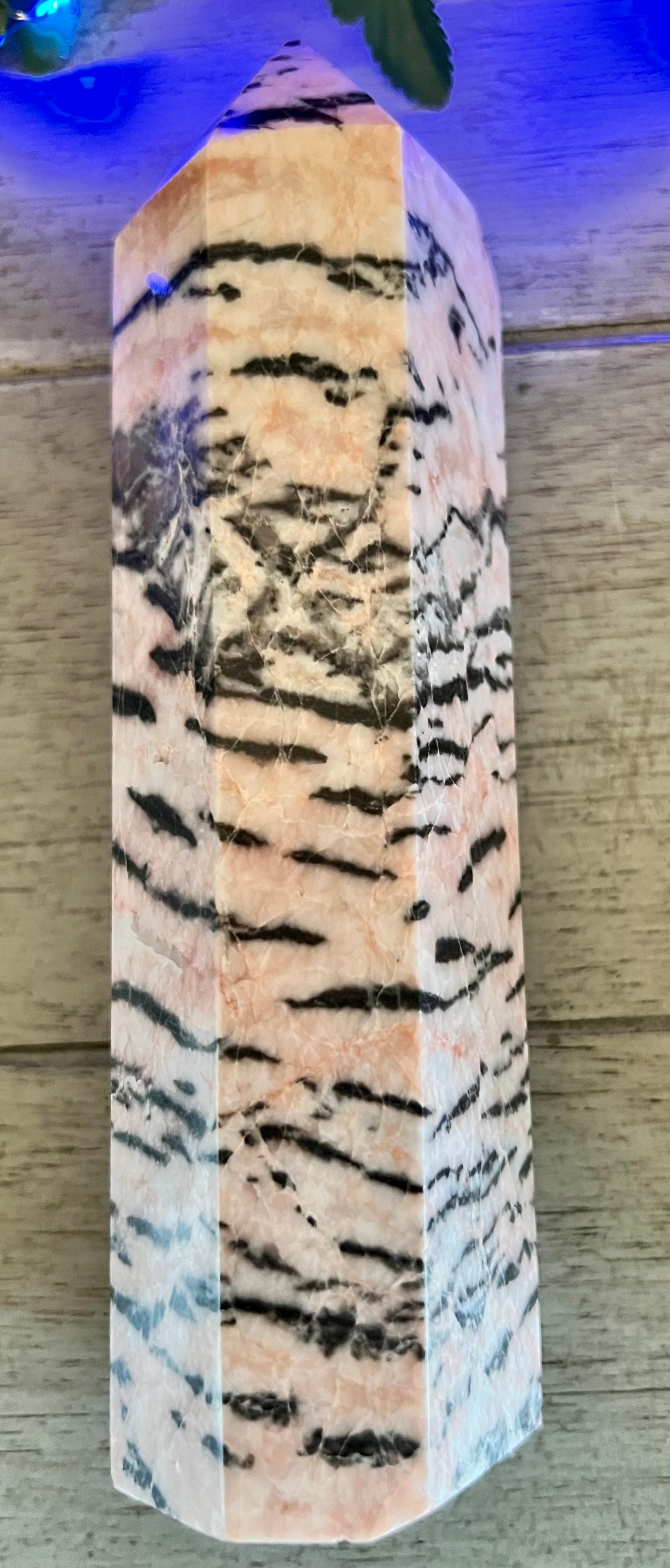 Tigereye-patterned crystal point.