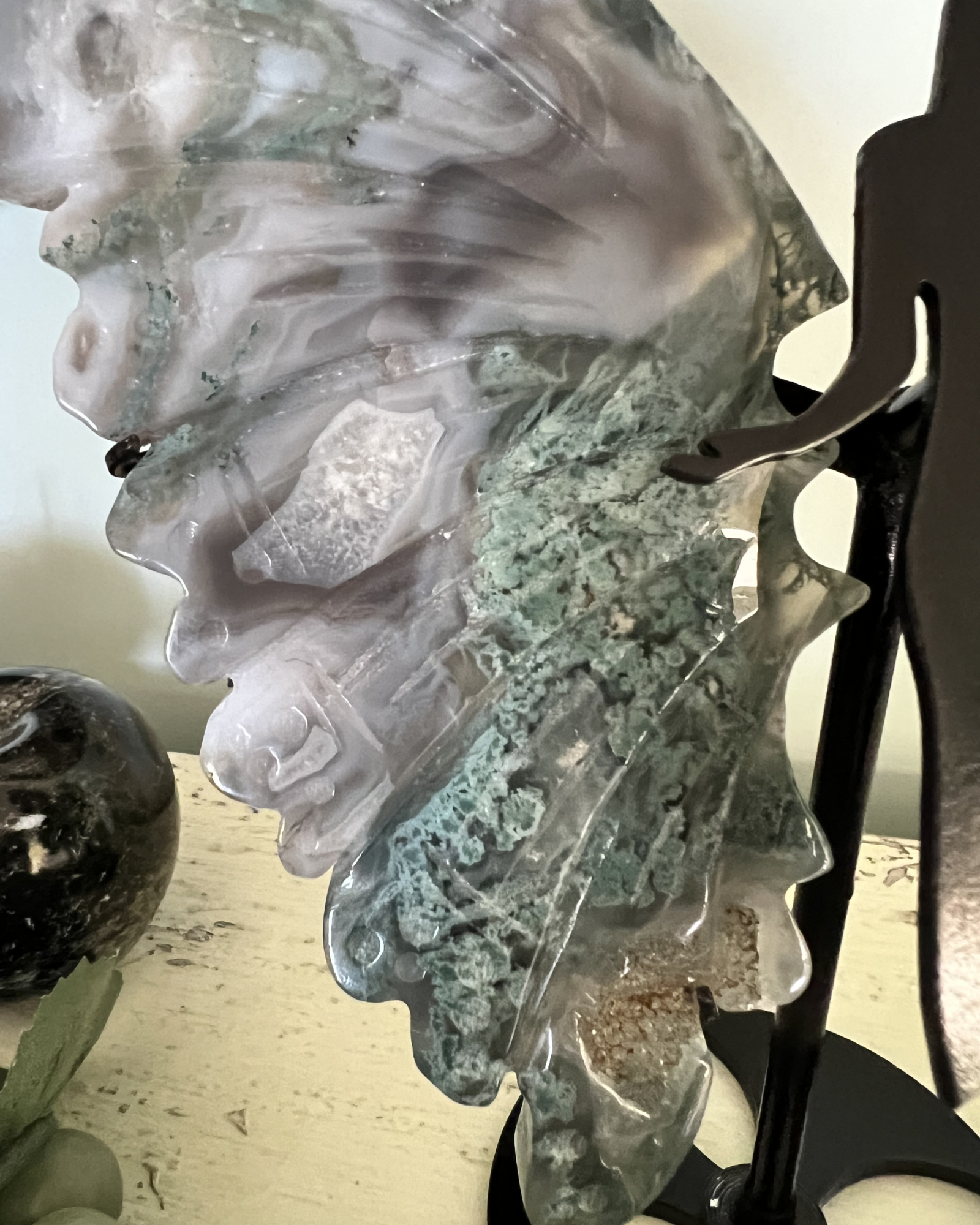 Green Moss Agate druzy wing sculpture on black metal stand