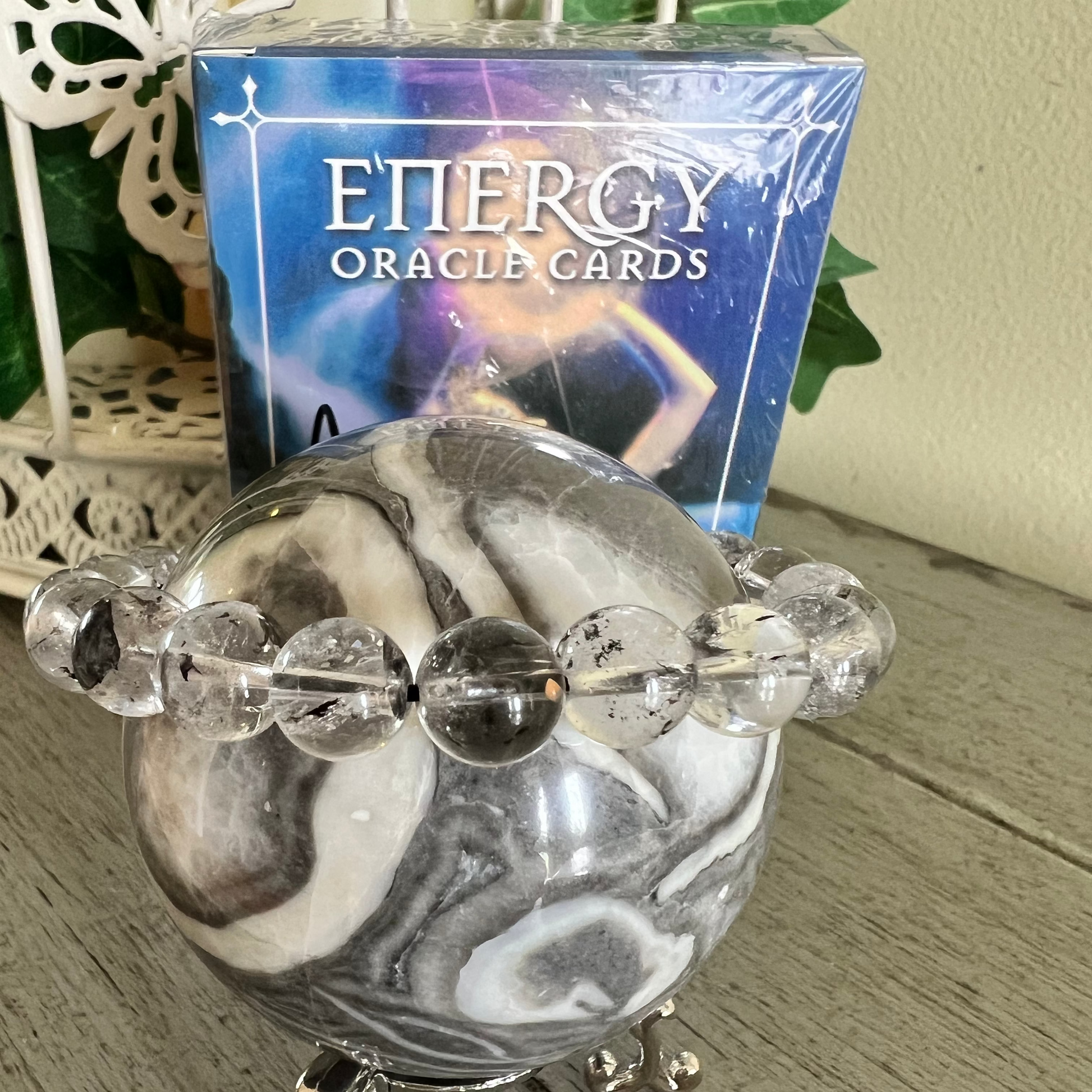 Thousand eye Jasper Sphere with clear quartz bead bracelet and energy oracle card deck