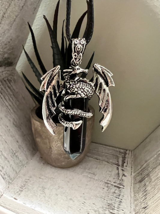 Dragon pendant necklace with black gemstone, silver dragon with spread wings.